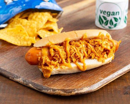 The famous Alien Dog ( Vegan Hot dog with specialty aliens sauce and choice of chips crushes on top)