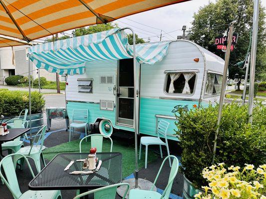 Outdoor patio with Shasta trailer!