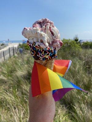 Raspberry truffle on a dipped waffle cone served with pride