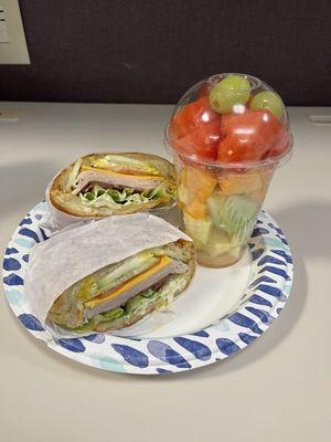 Turkey Club on a Croissant with a mixed fruit cup. Delicious and fresh.