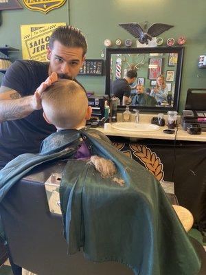 Gabe finishing the cut and style.