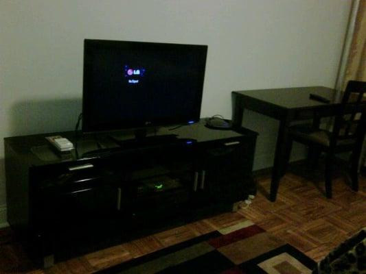 amazing tv stand , where you can organize and keep all of your  media, cable box, linksys, x-box etc. plenty of storage compart