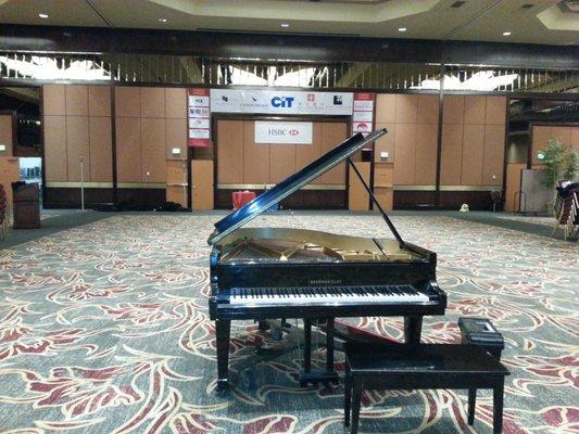 Tuning a grand piano in the ballroom of Hilton hotel Los Angeles.