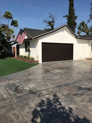 Remodeled exterior of home. Newly paved driveway, new paint job, installed synthetic grass etc.