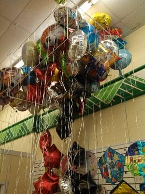 Balloons inflated for a dollar.  Limited mylar selection, but worth the look.