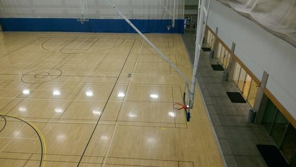 View of part of the imdoor basketball and gym from the indoor track on the second floor