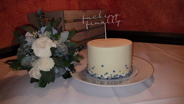 My wedding cake and my bouquet. And yes that was our cake topper. Lol.