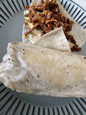 Al Pastor Loaded Breakfast Meat Quesarito and an Al Pastor Breakfast Cheese Taco.