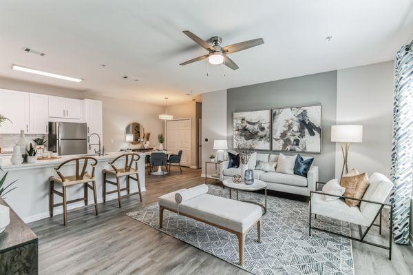 Open concept newly renovated apartment with living room with dine-in kitchen, dining room at The Oakley at Saraland near Mobile, AL