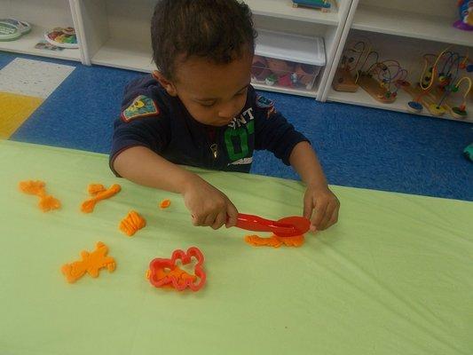 Fine motor work at it's best with play dough!