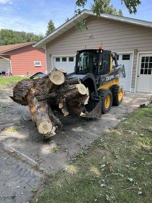 Moving a tree stump with the grapple!