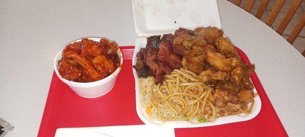 Sesame chicken, orange chicken, noodles, and pork.