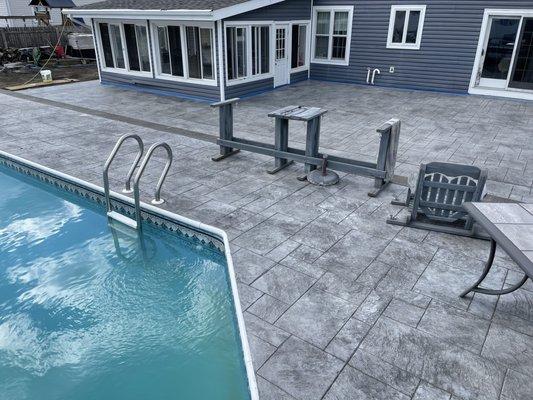 Stamped concrete pool deck by metric concrete