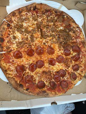 Large pizza half pepperoni half burger and sausage