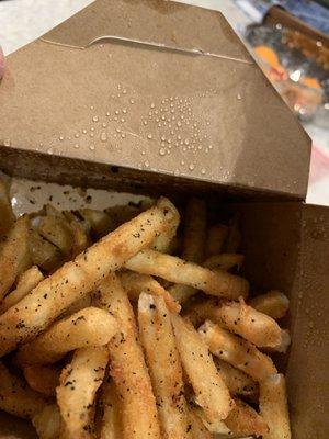 Fries generously spiced with burn food particles from overused frying oil.