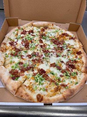 Chicken, bacon, and broccoli Alfredo pizza