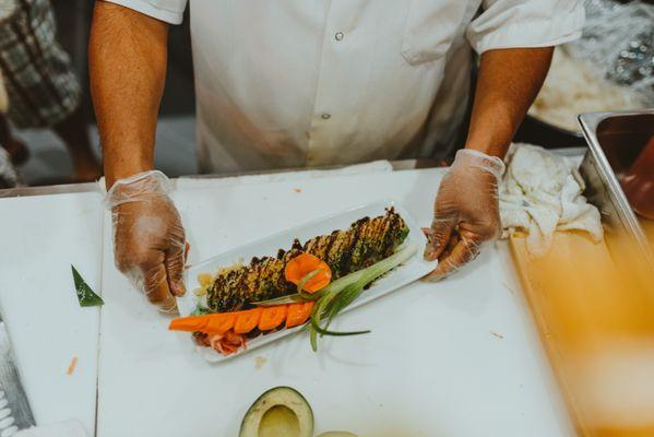 Deep Sea Roll - Tuna, Avocado, topped with Scallions, Eel Sauce & Spicy Mayo.