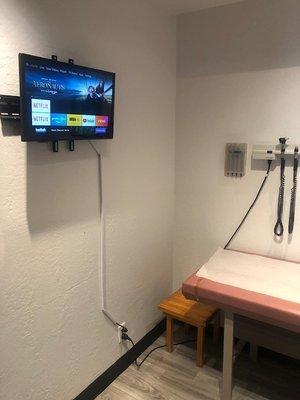 Patient exam room with television to keep you entertained while waiting to be seen by provider or review allergy test results