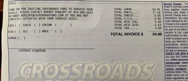 The cost of oil change and tire rotation at Crossroads Ford Dealership.