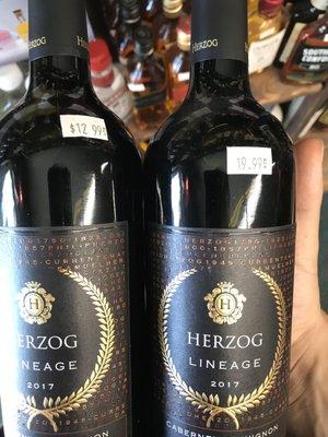 Side-by-side with another bottle of the same type with a higher price tag.