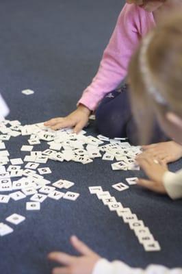 Each morning as the kids arrive, everyone plays "floor games" (puzzles, board games, etc.) while they wait for the day to begin.