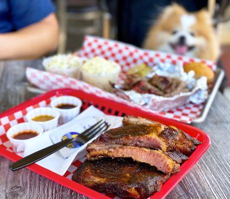 1/2 Rack Ribs, a la carte ($18) + 1/2 lb Smoked Brisket Plate w/ potato salad, coleslaw, corn muffin ($18.99)