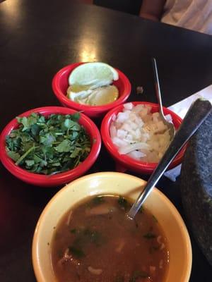 Instead of chips and salsa they bring you charro beans, onions, cilantro and limes.