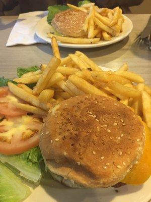 Veggie Burger & Cheese burger in background