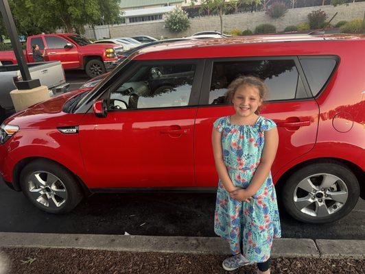 Baby girl in love with the new car!