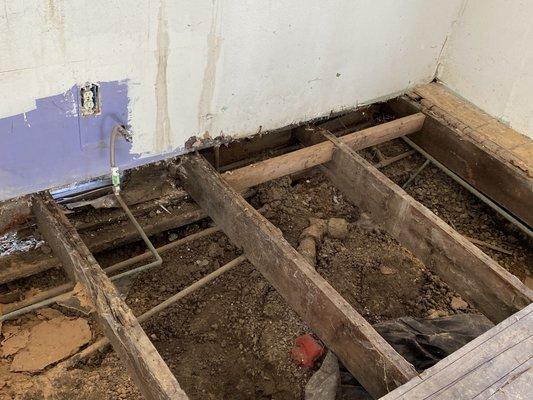 Dry rotted floor system and failed foundation