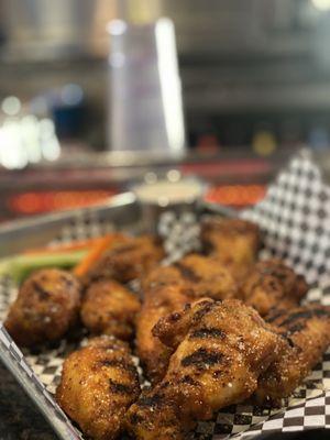 Traditional wings in jacks honey hot , grilled then tossed in their signature BKDS rub