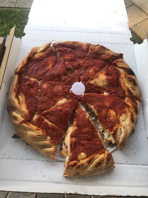 Stuffed pizza with Italian Beef and green peppers.