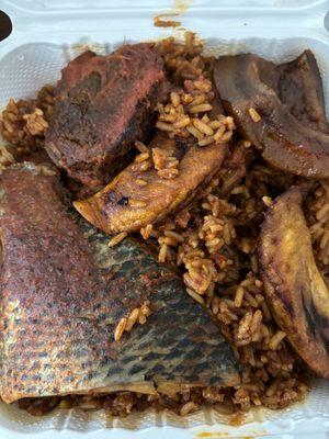 Jollof rice w/ beef, tilapia, cow skin, and plantain