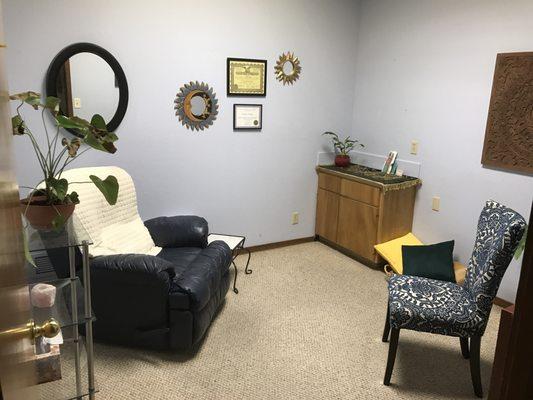 Private area for clients with their hypnotist. A reclining chair helps clients relax for hypnosis.