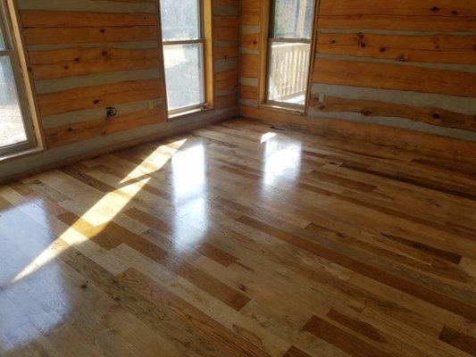 Cabin showing chinking and wood floors.