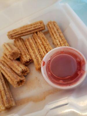 Churros with strawberry sauce