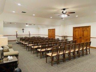 Back view of Beautifully renovated East Chapel also known as the Clock Room. With New Carpet, updated Furniture, and Bright lighting.