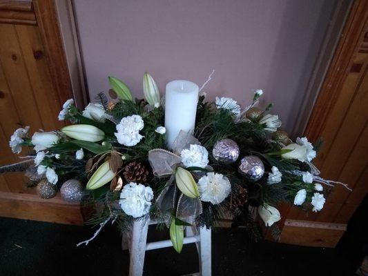 Holiday long and low centerpiece with a pillar candle