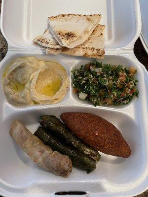 Baked Kibbeh combo with Stuffed Grape Leaves and Stuffed Cabbage Rolls + Tabouleh Salad + Baba Ghanouj and Hummus + pita bread