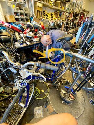 The guy using his tool trying to remove/ remount the tire