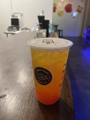 mango green tea with strawberry popping boba