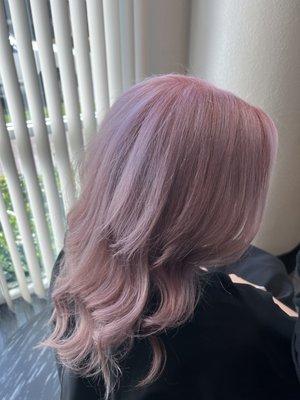 Beige rose hair color with long layers.