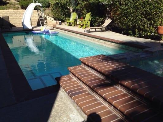 White plaster sparkling clean pool.