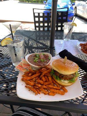 Veggie burger , sweet potatoes fries and a side of red beans and rice.