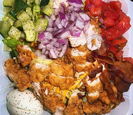 Crispy Popcorn Chicken Salad. Added bacon and eggs, removed bell peppers and had toppings chopped.