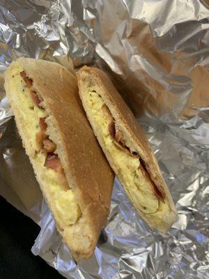 Scrambled eggs & bacon on Cuban bread