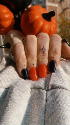 orange & black acrylics done by ivy!