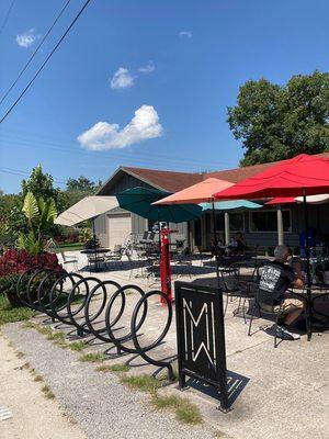 Outdoor seating and bike rental area outside of gift shop