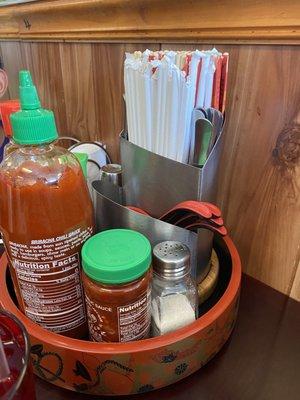 Need some sauces or utensils - they got you covered right at your table!