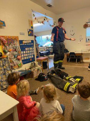 A Parent who is a Firefighter visits the classroom to share what it is like to be a firefighter. Many of our parents conduct Circle Time.